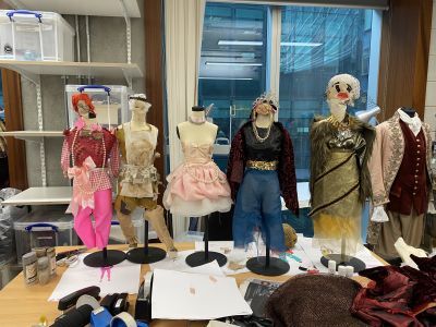 Small mannequins wearing different costumes - designed by Get Backstage participants